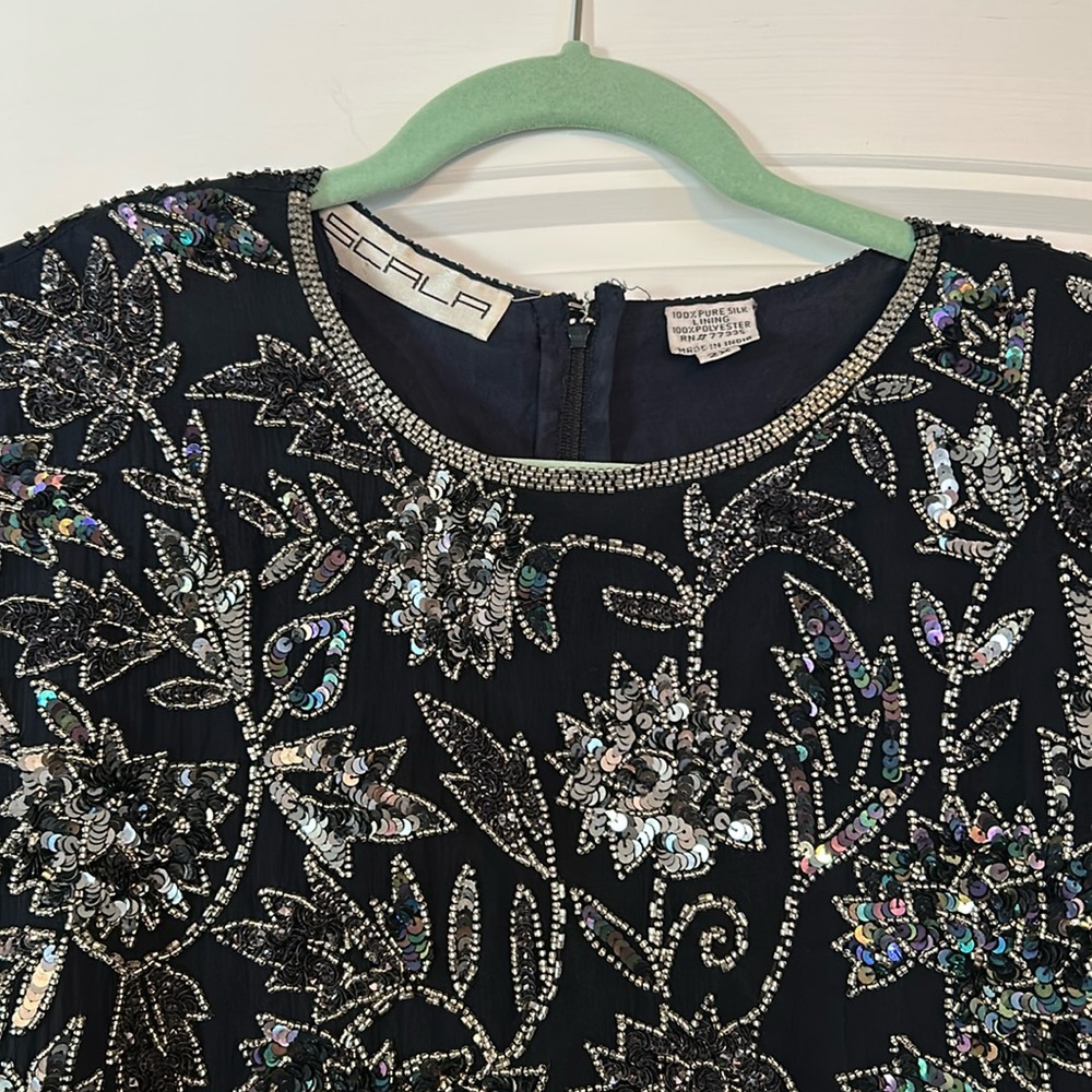 Silk dark blue beaded gown.